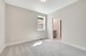 secondary bedroom with a window