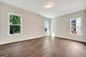 primary bedroom with three windows