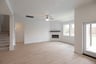 open great room with wood floors and fireplace