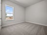 bedroom with carpet, window & recessed lighting