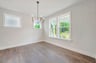 dining room with a chandalier