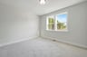 secondary bedroom with two windows