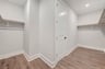 primary closet with wood shelves