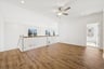 loft with a ceiling fan and access to the secondary bedrooms