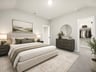 secondary bedroom with carpet and sloped ceilings 