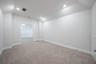 large media room with carpet and recessed lights 