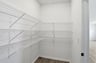 walk-in pantry with wire rack shelving