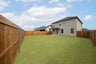 backyard with grass and covered patio