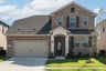 two-story home with brick and stone exterior