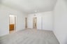 primary bedroom with carpet