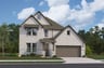 home with brick, windows, garage and landscaped grass 