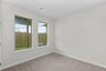 secondary bedroom with two windows