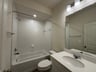 secondary bathroom with a tub/shower combo