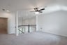 open gameroom with carpet and ceiling fan