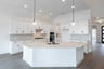 open kitchen with wood floors and island