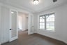 private study with wood floors and windows