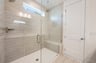 oversized shower with a seat and a window