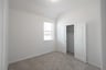 bedroom with carpet and window with blinds 