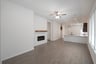 great room with fireplace and celling fan 