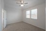 bedroom with carpet and ceiling fan 