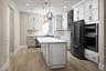 kitchen with white ceiling height cabinets, wood floors, island, and window above sink