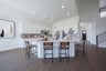 open kitchen with white cabinets and hardwood flooring
