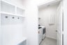 laundry room with white cabinets