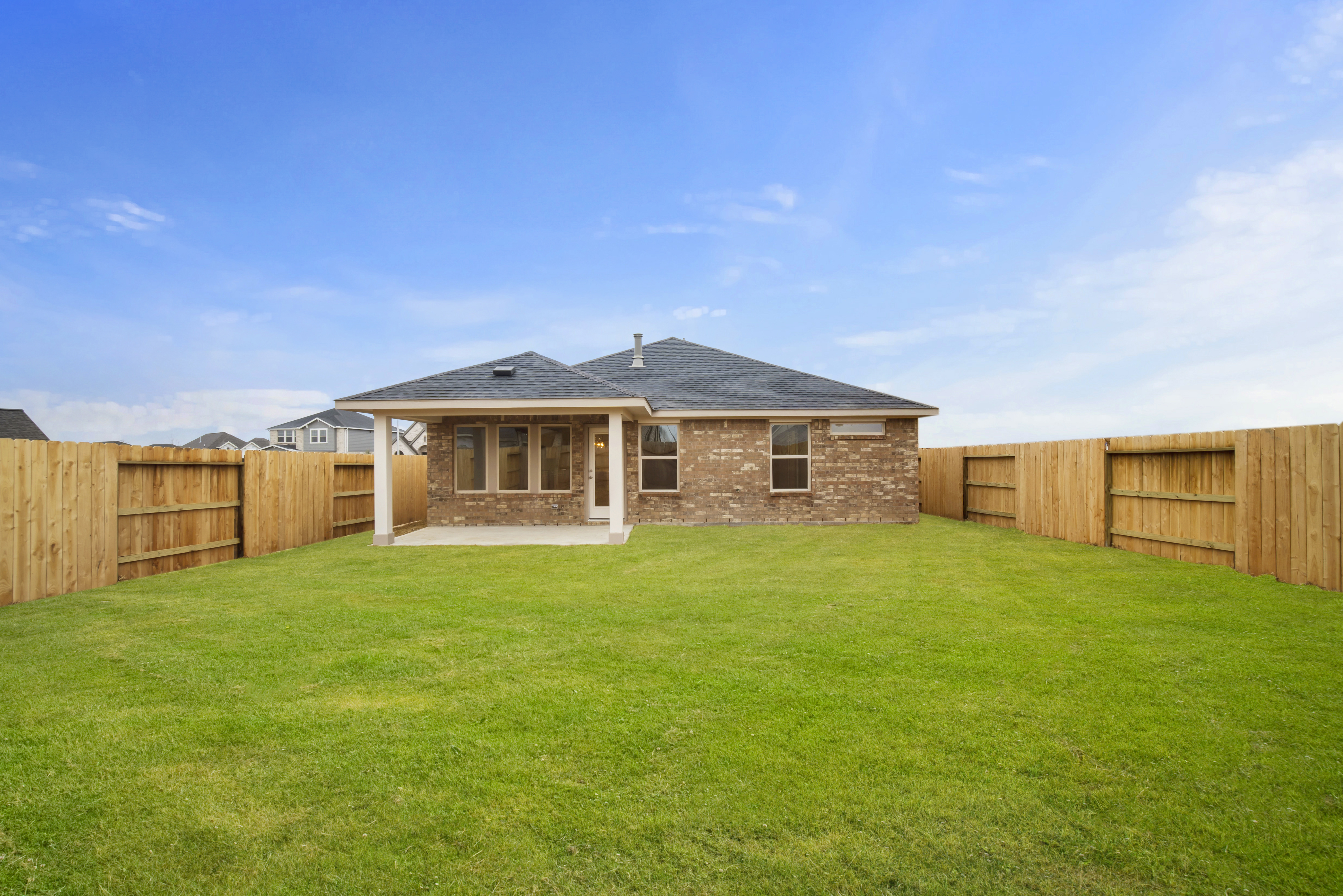 covered patio with wood fencing