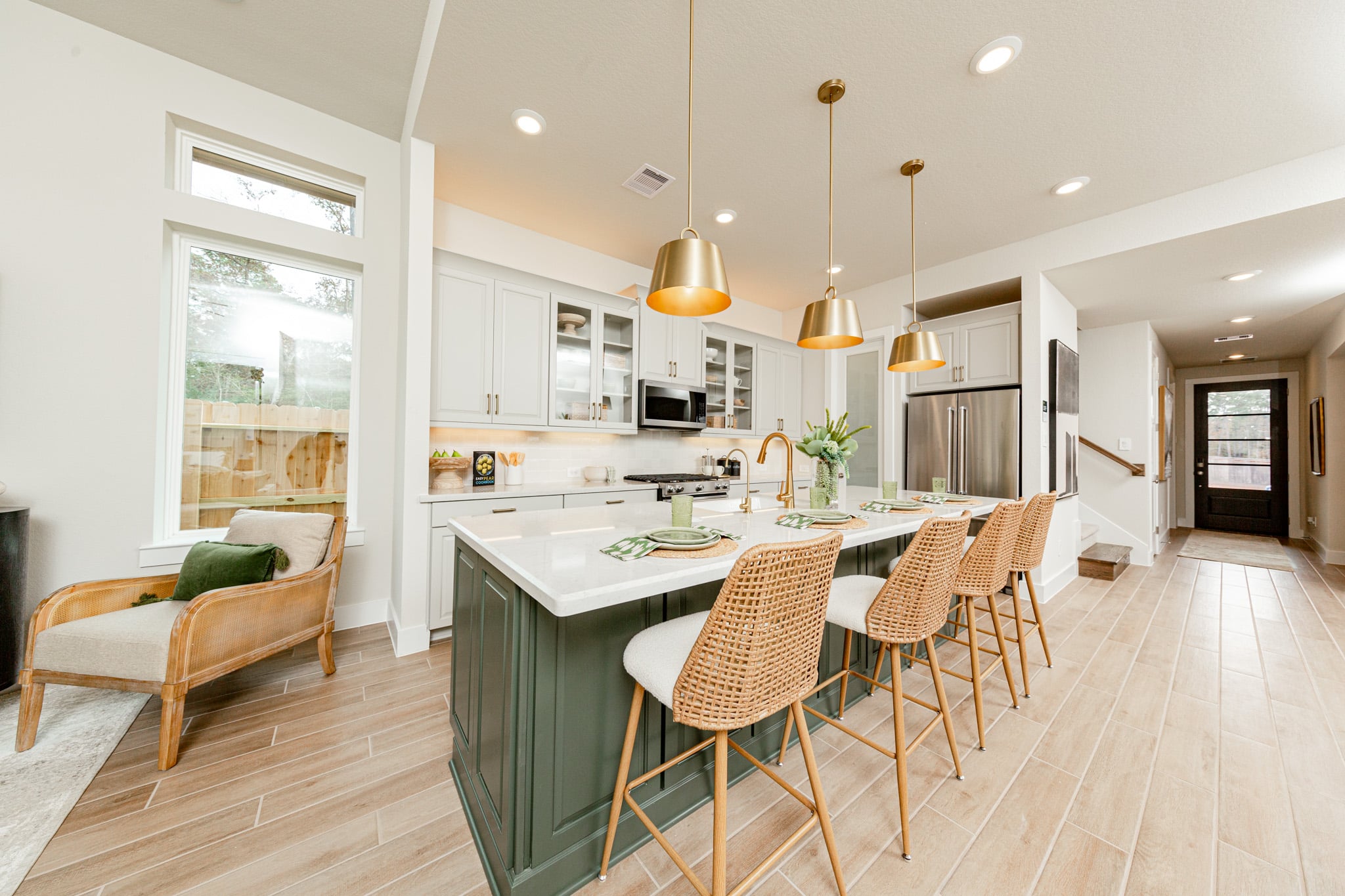 kitchen with gold pendant lights over island