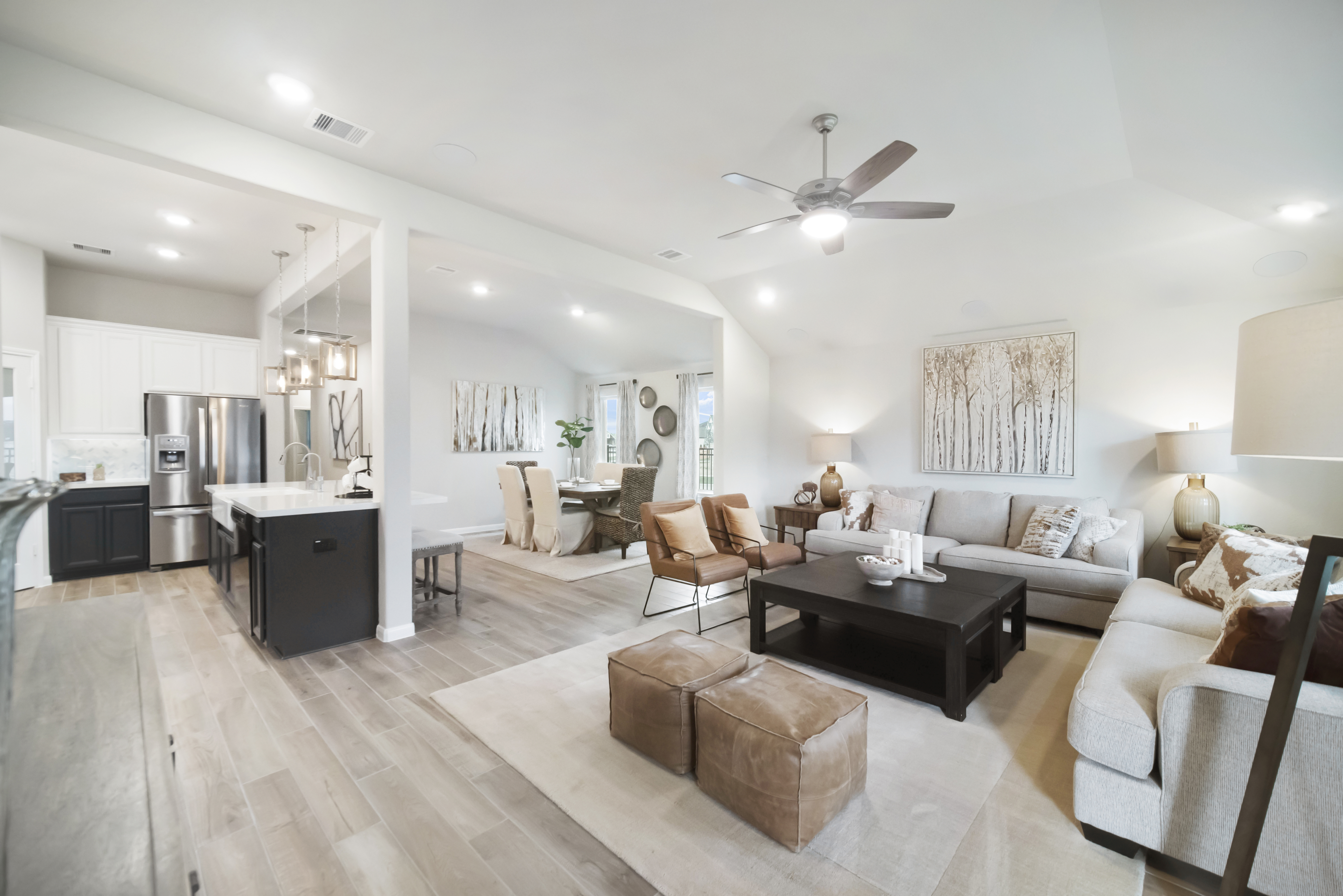 great room with ceiling fan