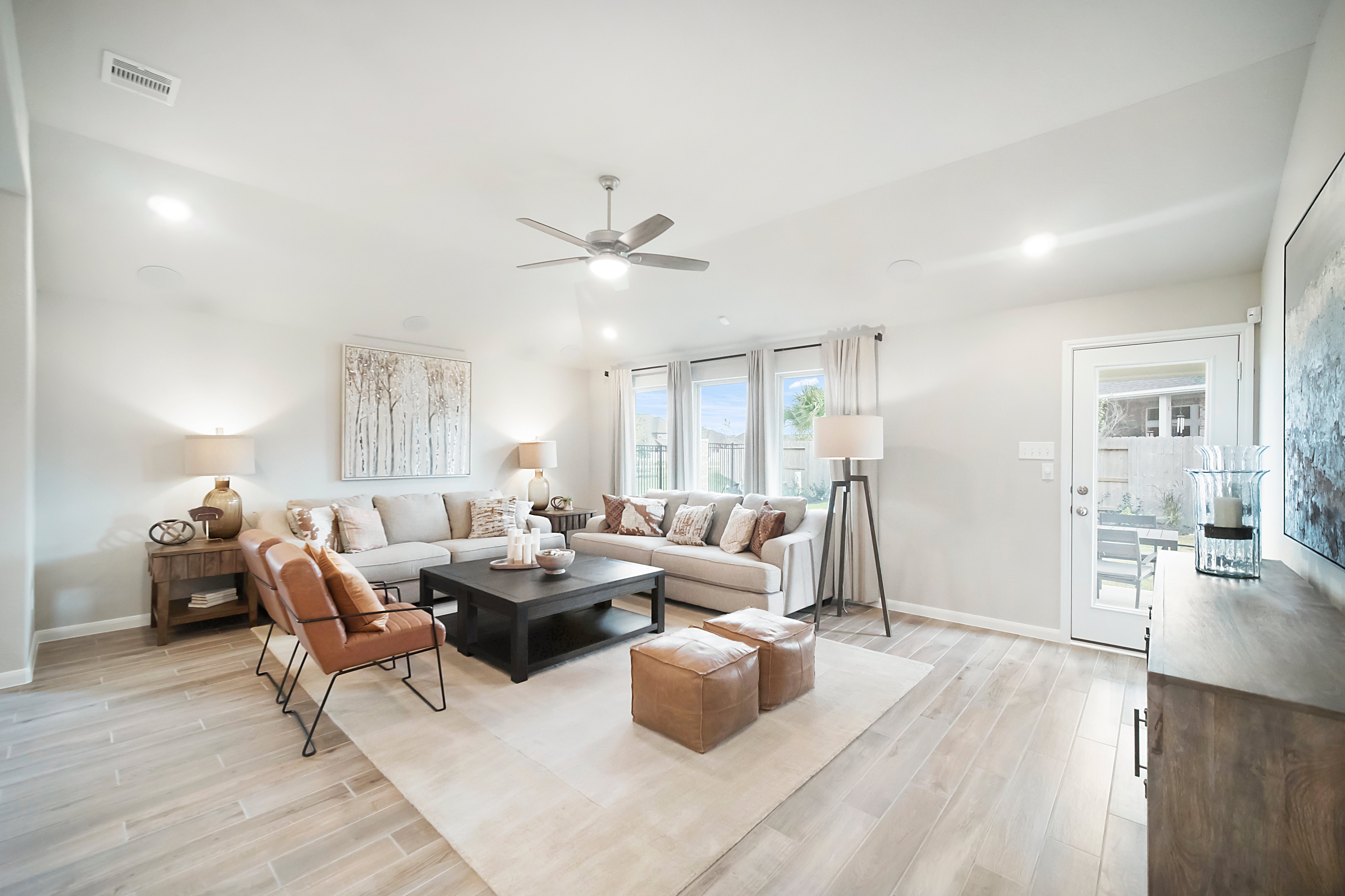 great room with ceiling fan